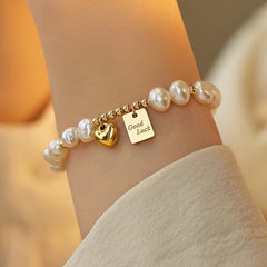 "Charming Fortunes" - Pearl Bracelet with Gold Accents and Lucky Charms